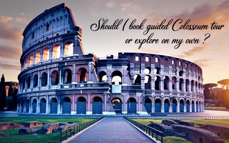 The Roman Colosseum at sunset with the text Should I book guided Colosseum tour or explore on my own? written on the sky. The ancient amphitheater appears illuminated with a clear pathway in front.